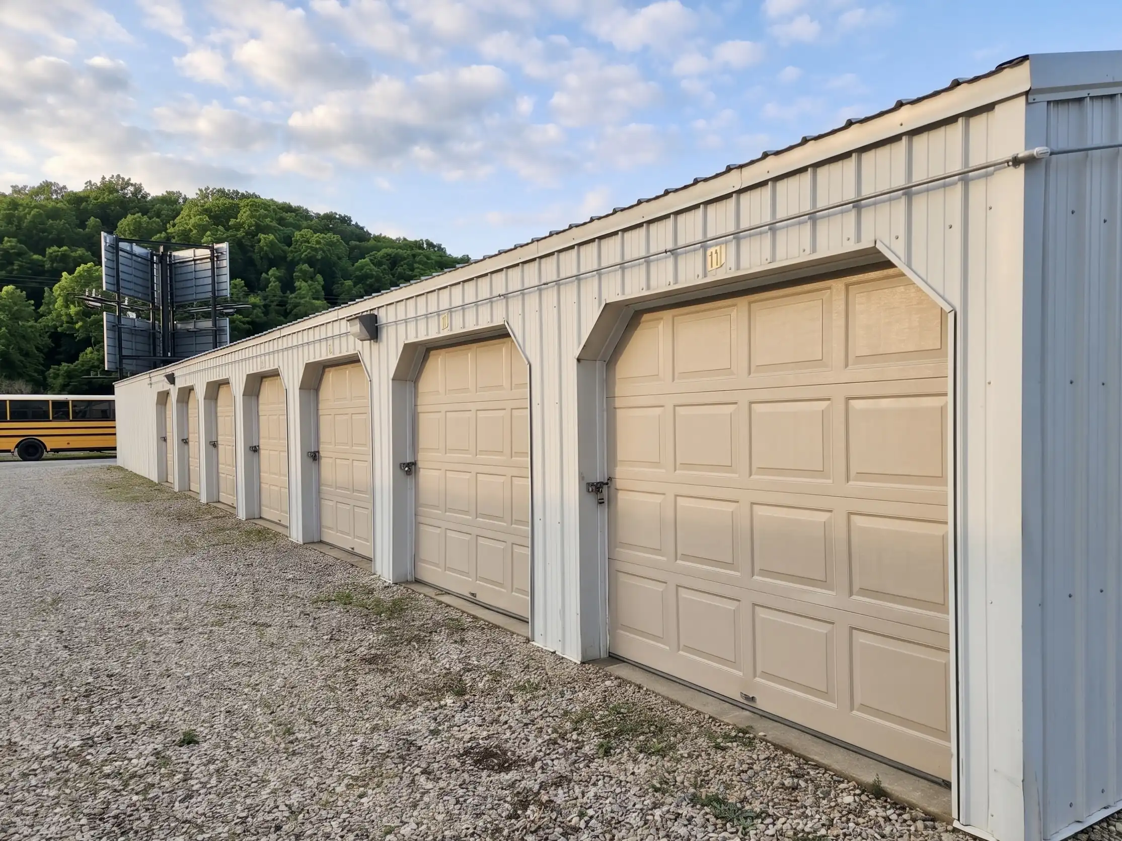 Row of clean tan roll-up storage units at GSG Self Storage on Highway 54